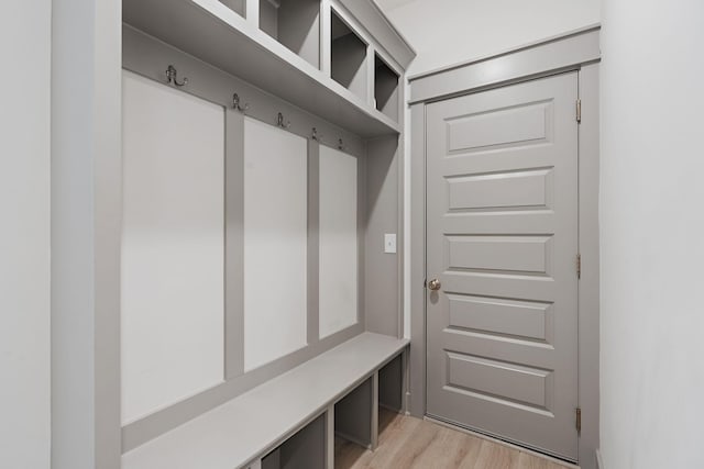 mudroom with light wood-style floors