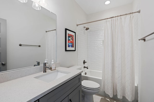 bathroom with toilet, shower / bath combination with curtain, and vanity