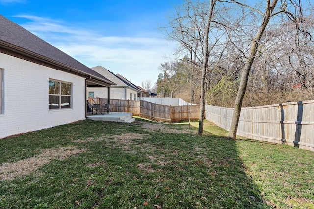 view of yard featuring a patio area and a fenced backyard