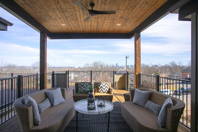 wooden deck featuring ceiling fan and outdoor lounge area