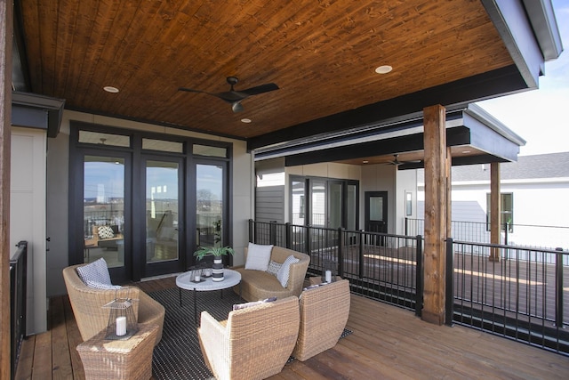 wooden deck featuring ceiling fan and an outdoor hangout area