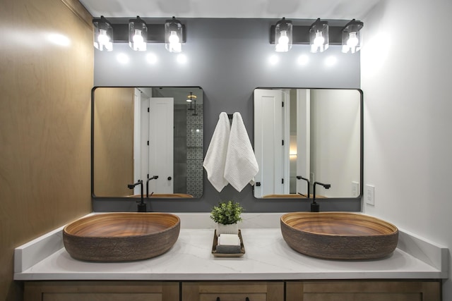 bathroom with double vanity and a sink