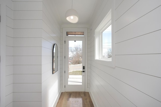 entryway with wood finished floors