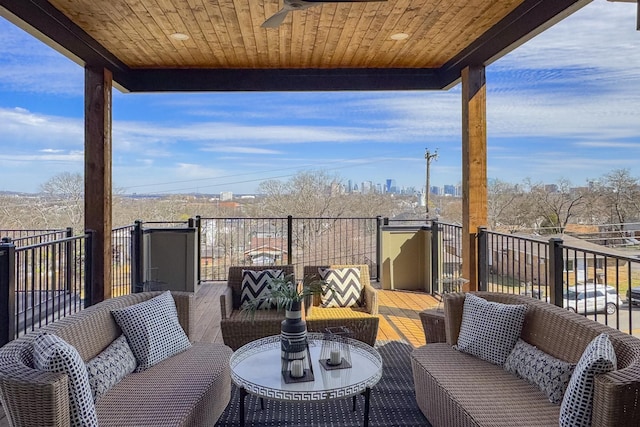 balcony featuring outdoor lounge area and a ceiling fan