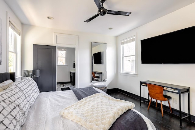 bedroom featuring dark wood-style floors, baseboards, and a ceiling fan