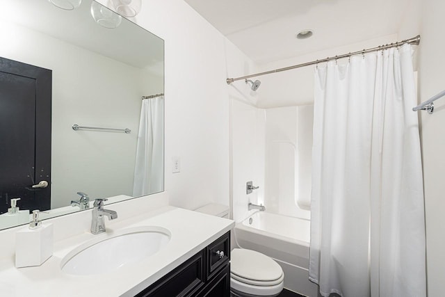 bathroom featuring shower / tub combo with curtain, vanity, and toilet