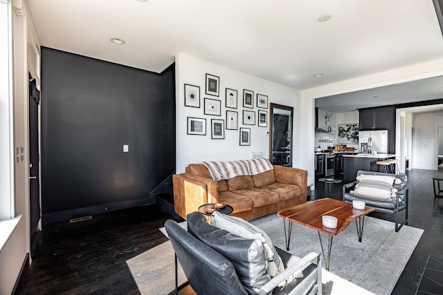 living area featuring dark wood-type flooring