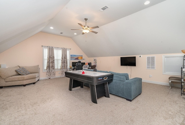 rec room featuring lofted ceiling, visible vents, light carpet, and baseboards