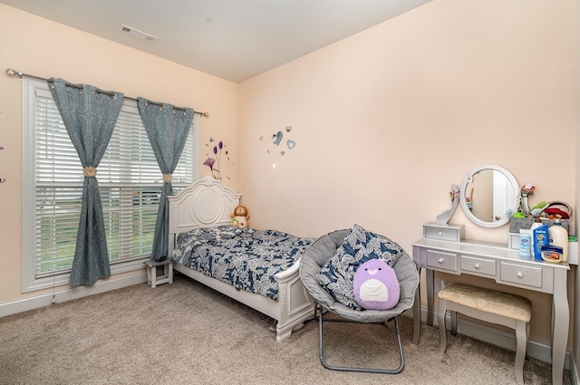 bedroom featuring carpet flooring and visible vents