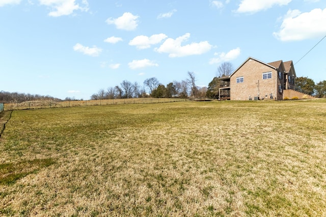 view of yard with a rural view