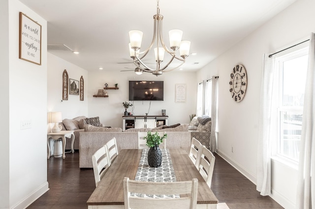 dining space with recessed lighting, dark wood-style flooring, a notable chandelier, and baseboards