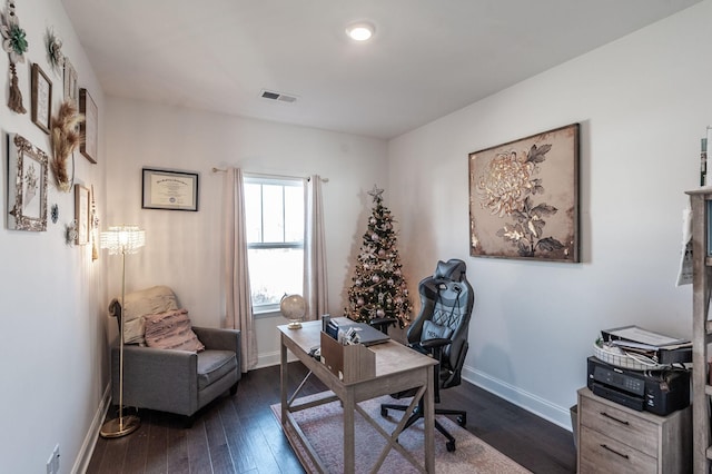 home office featuring dark wood finished floors, visible vents, and baseboards