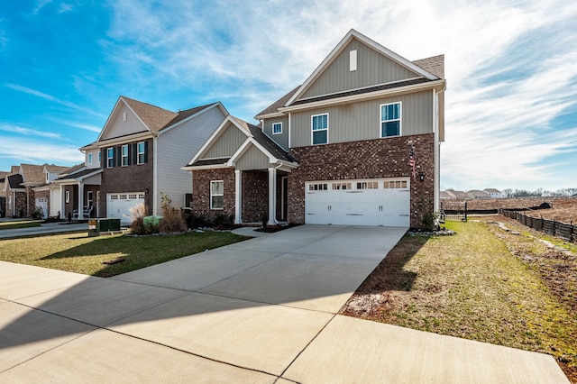 view of front of home featuring driveway, brick siding, an attached garage, and a front yard