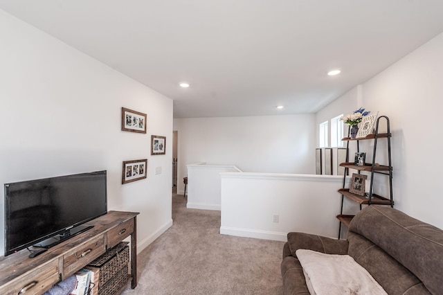 interior space featuring recessed lighting, light colored carpet, and baseboards