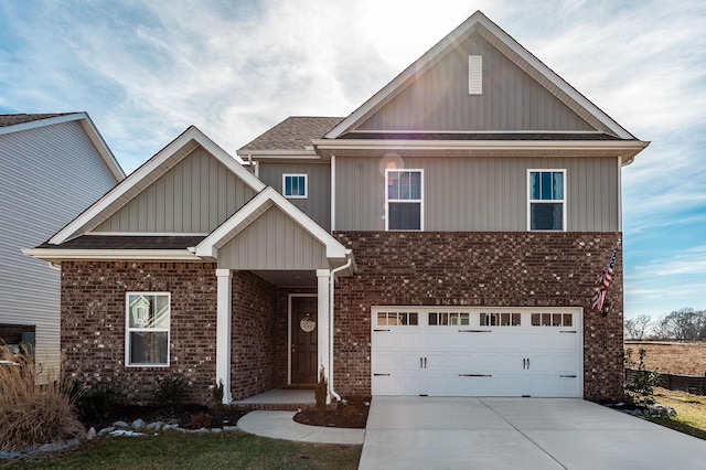 view of front of property with a garage, brick siding, driveway, and roof with shingles