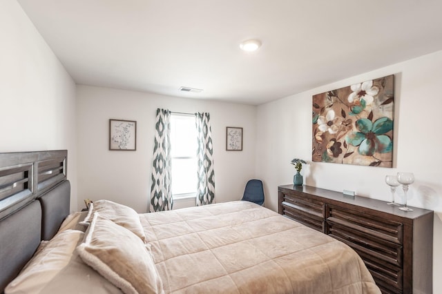 bedroom with visible vents