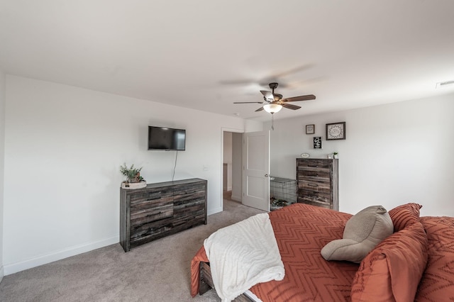 bedroom featuring baseboards, ceiling fan, visible vents, and light colored carpet