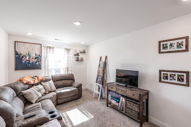 living area with light carpet, visible vents, and baseboards