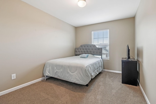 bedroom featuring carpet floors and baseboards