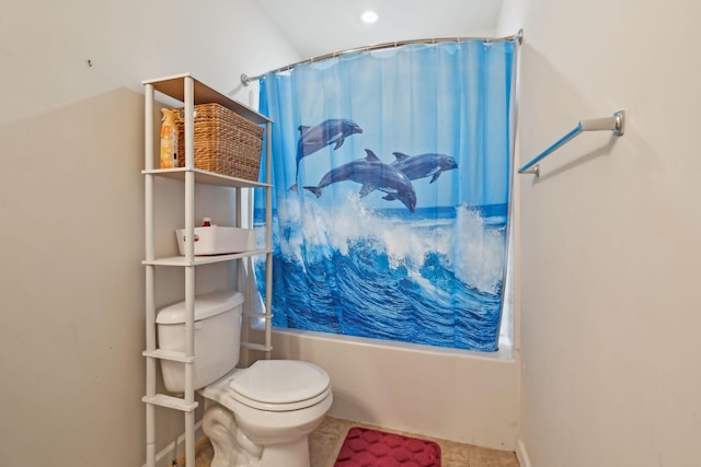 bathroom featuring shower / tub combo with curtain, toilet, and tile patterned floors