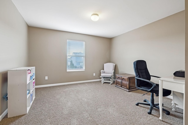 carpeted office featuring baseboards