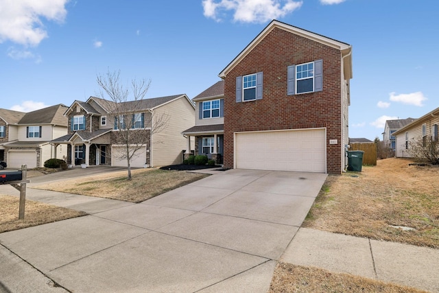 traditional-style home featuring a garage, concrete driveway, brick siding, and a residential view