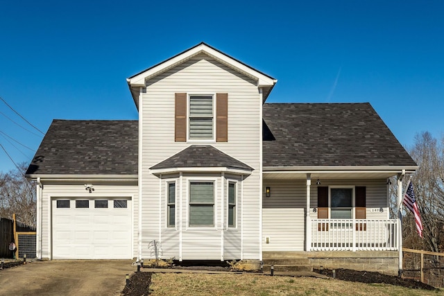 traditional-style home with a garage, driveway, a porch, and a shingled roof