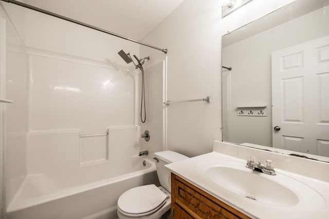 bathroom with shower / bathtub combination, vanity, and toilet