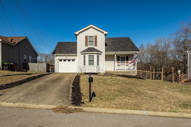 traditional home featuring a porch, an attached garage, fence, driveway, and a front lawn