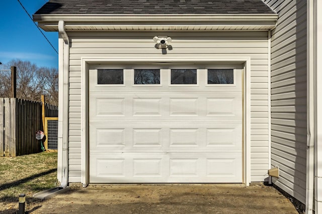 garage with fence