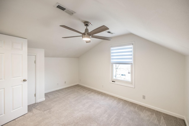 bonus room with light carpet, baseboards, and visible vents