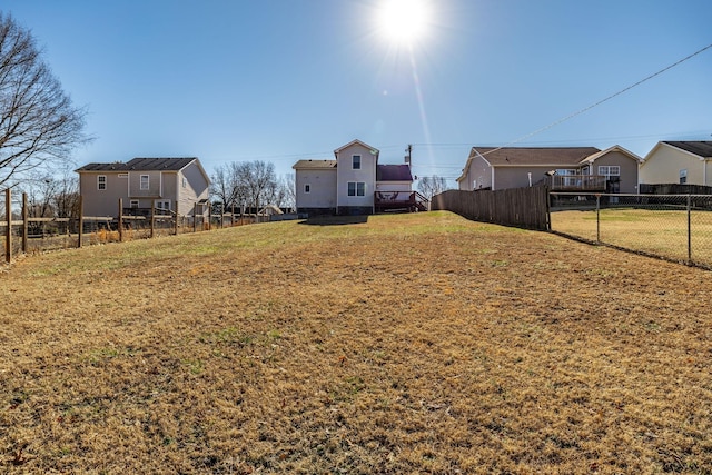 view of yard featuring a residential view and fence