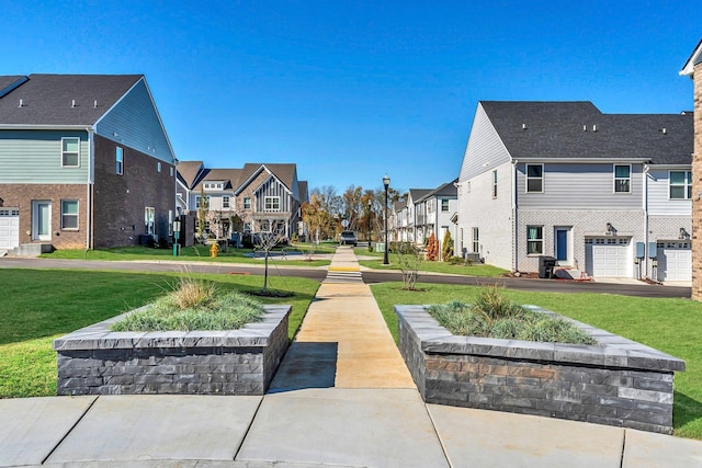 view of home's community featuring a lawn and a residential view