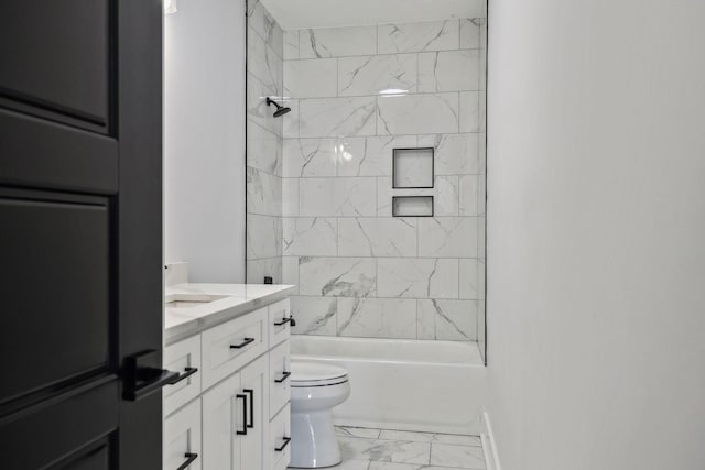 bathroom featuring marble finish floor, tub / shower combination, vanity, and toilet