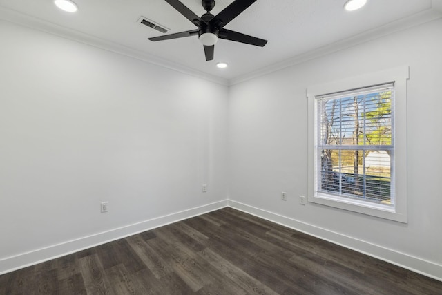 empty room with recessed lighting, dark wood-type flooring, visible vents, baseboards, and ornamental molding