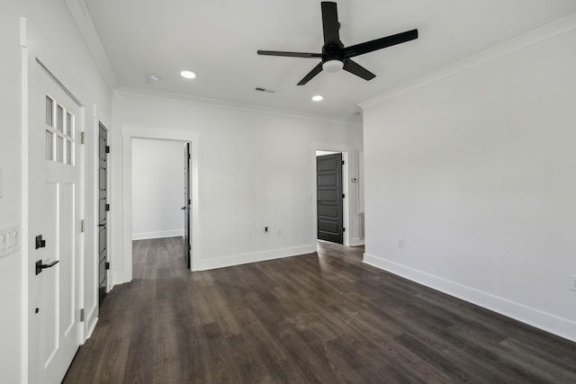 empty room featuring visible vents, baseboards, dark wood-style floors, ornamental molding, and recessed lighting