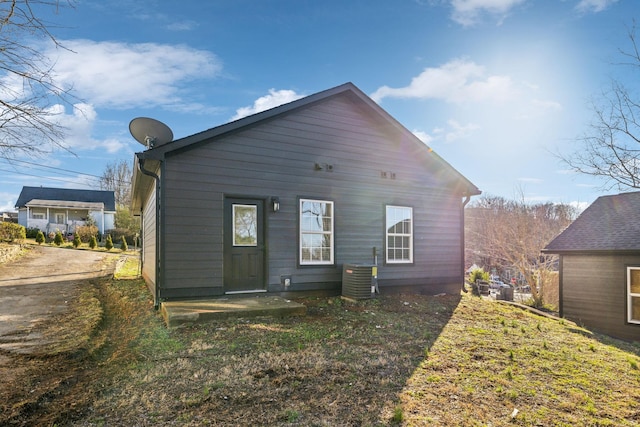 back of house with central air condition unit