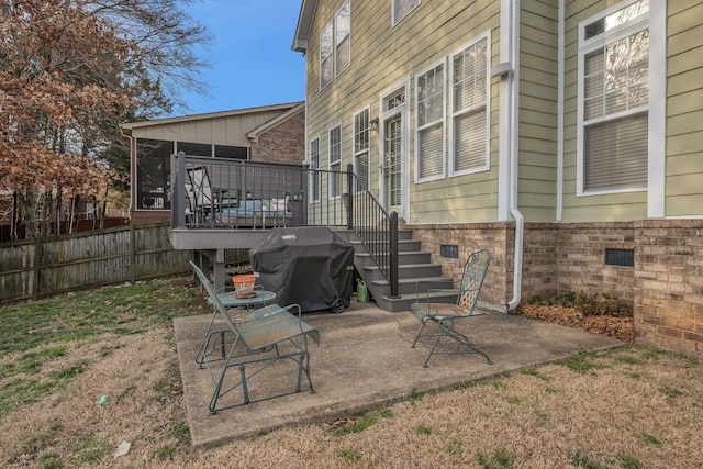 view of patio / terrace featuring a sunroom, stairway, a grill, fence, and a deck