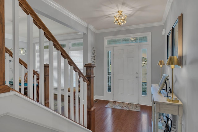 foyer entrance featuring stairway, baseboards, ornamental molding, and dark wood-type flooring