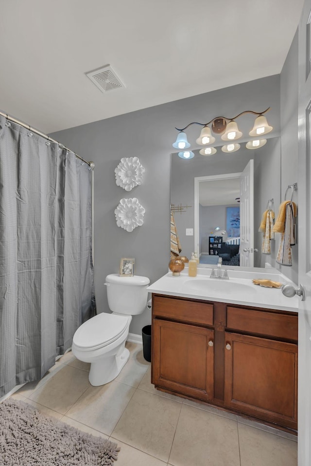 bathroom featuring visible vents, toilet, ensuite bath, tile patterned floors, and vanity