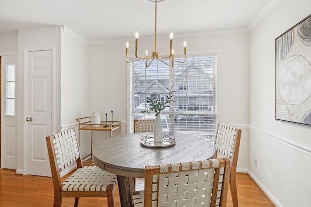 107 Sylvan Glen Ct, Nashville, TN 37209 - dining area featuring light wood-type flooring, baseboards, ornamental molding, and a notable chandelier