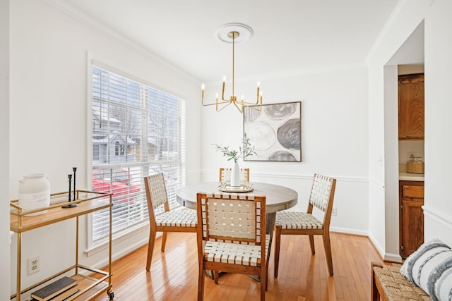 107 Sylvan Glen Ct, Nashville, TN 37209 - dining space with crown molding, light wood-style flooring, baseboards, and an inviting chandelier