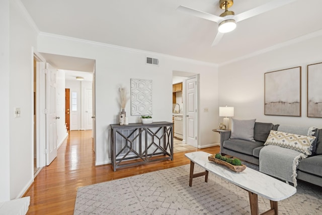 107 Sylvan Glen Ct, Nashville, TN 37209 - living area with baseboards, visible vents, a ceiling fan, light wood-style flooring, and crown molding