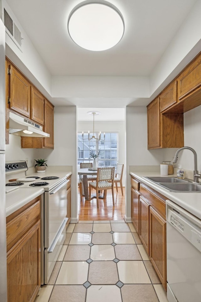 107 Sylvan Glen Ct, Nashville, TN 37209 - kitchen featuring under cabinet range hood, white appliances, a sink, visible vents, and light countertops