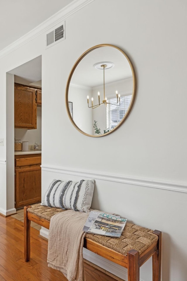107 Sylvan Glen Ct, Nashville, TN 37209 - interior space with ornamental molding, a chandelier, visible vents, and wood finished floors