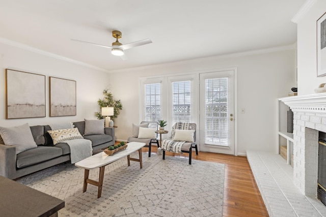 107 Sylvan Glen Ct, Nashville, TN 37209 - living room featuring light wood-style floors, ceiling fan, a fireplace, and ornamental molding