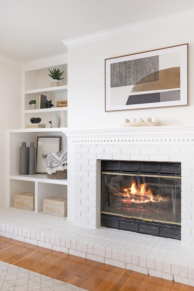 107 Sylvan Glen Ct, Nashville, TN 37209 - interior details with wood finished floors, a brick fireplace, built in features, and crown molding