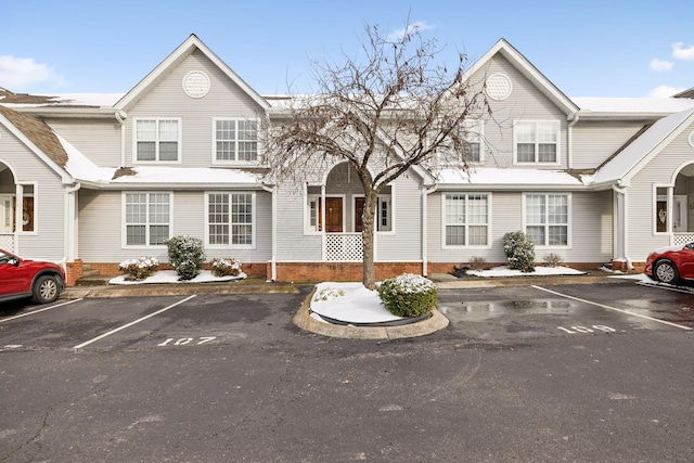 view of property featuring uncovered parking