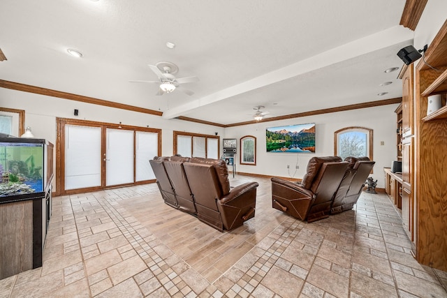 living area with ornamental molding, stone tile flooring, baseboards, and a ceiling fan