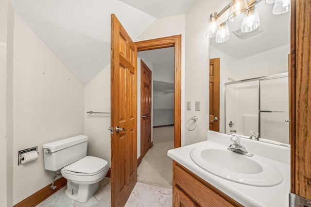 bathroom featuring toilet, vanity, vaulted ceiling, marble finish floor, and a shower stall